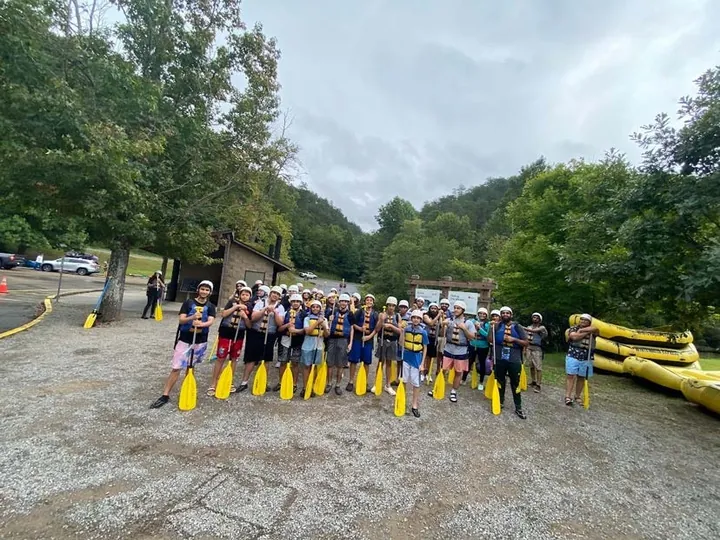 MMY youth with paddles before a rafting trip, 2022