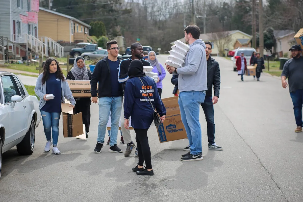 MMY volunteers carrying meals and supplies during Nashville tornado relief in 2020