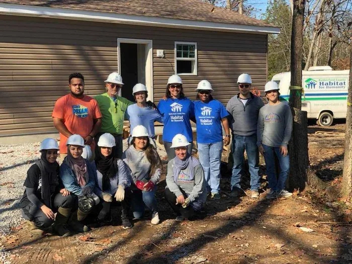 MMY volunteers at a Habitat for Humanity home build