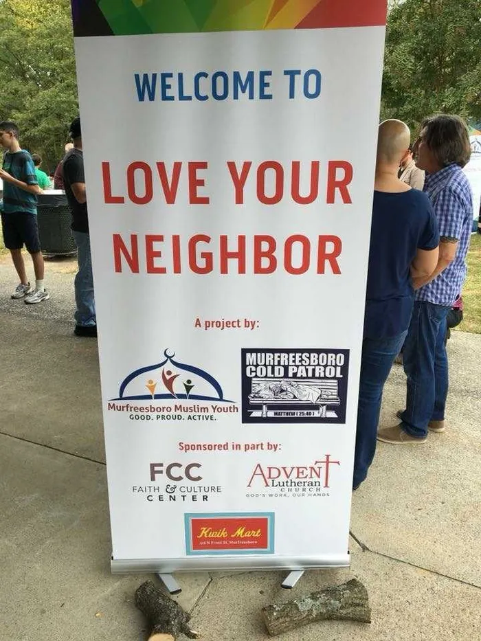 The Welcome to Love Your Neighbor sign in downtown Murfreesboro