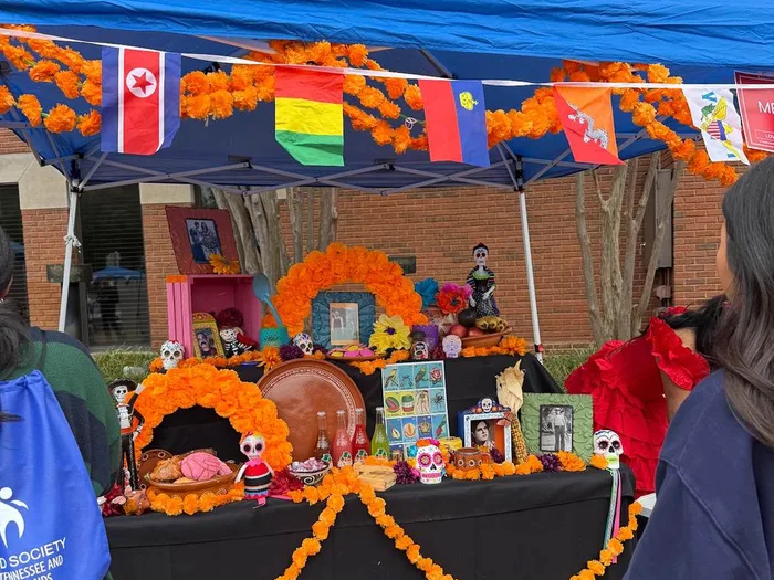 A Día de los Muertos altar booth at Love Your Neighbor